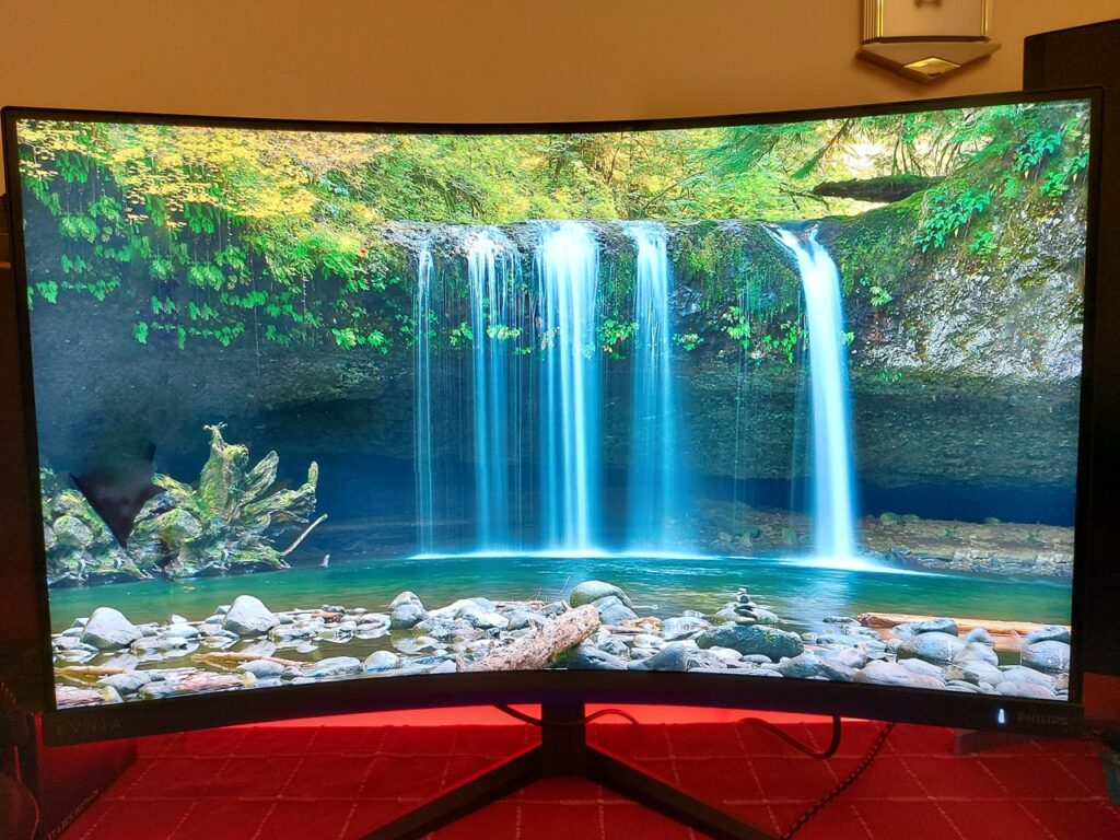 Evnia 32M2C5500 showing an image of a waterfall. The colours lack vibrancy